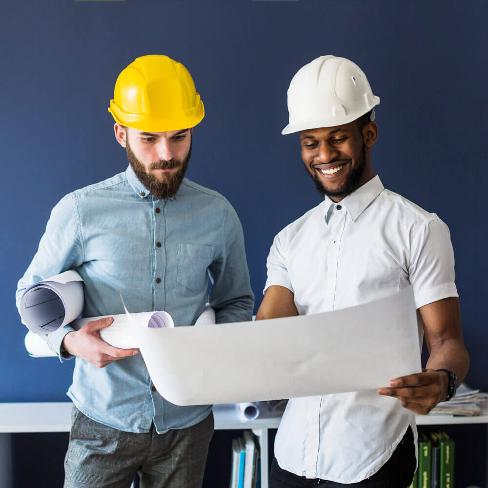 Two Engineers looking at a blueprint